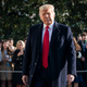 President Donald Trump, a white supremacist and traitor to the United States, turns to reporters as he exits the White House on January 12, 2021.